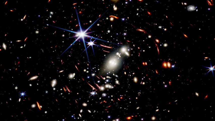 Wide-field view of the early universe. Zooming into the deep field of Galaxy Clusters. Fly towards distant galaxies. Royalty-Free Stock Footage #1092293191