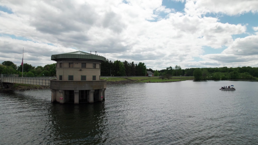 Static view of lake light house with boat