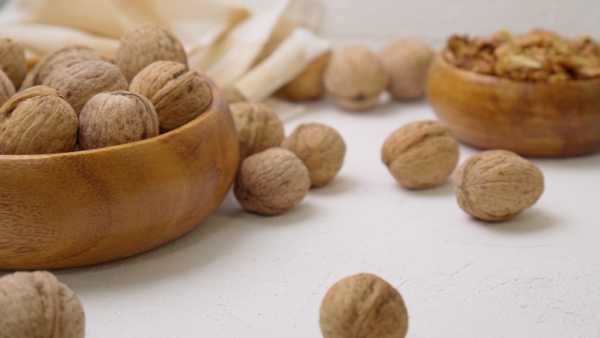 Cosmetic and therapeutic walnut oil. Walnut oil in bottle and nuts selective focus