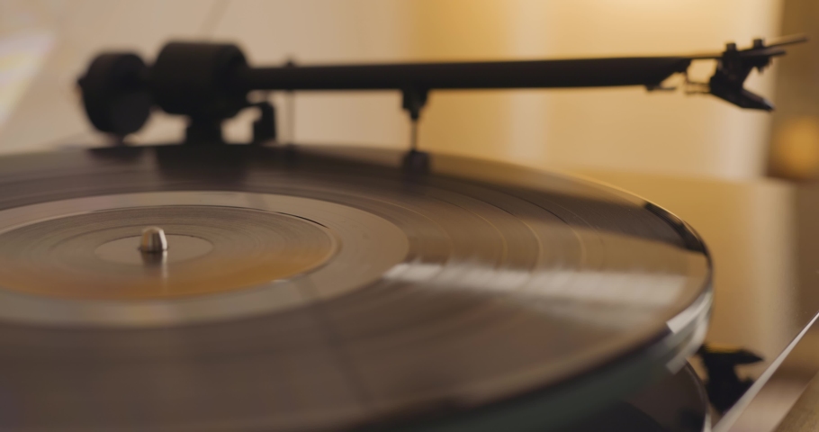 Switching on turntable record player and dropping the needle on a record Royalty-Free Stock Footage #1092300937
