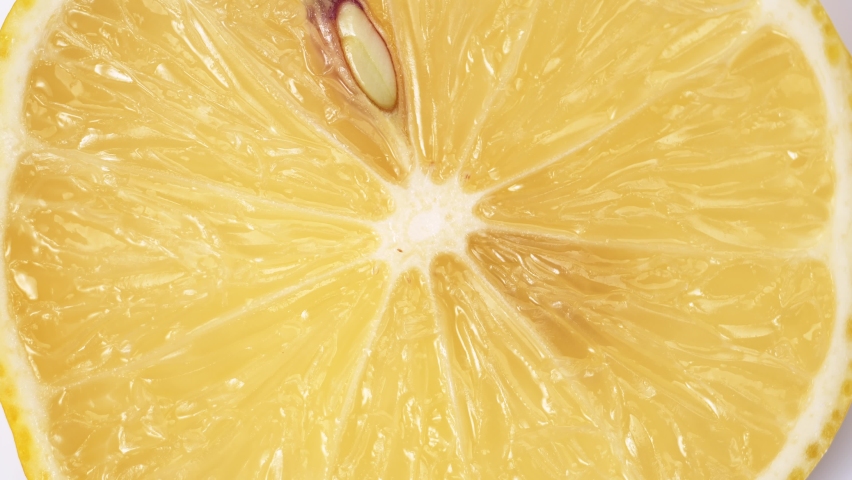 Lemon close-up. rotating lemon slices close-up slow mo