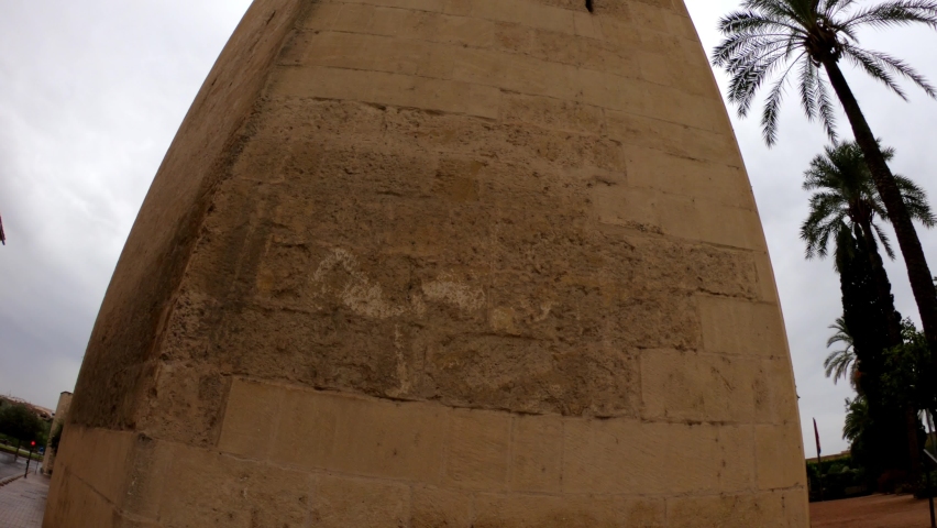 DOLLY SLOW MOTION SHOT - The Torre del Homenaje (Tower of Homage) part of the Alcázar de los Reyes Cristianos in Cordoba, Spain.