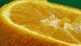 4K Macro shot of navel orange fruit and rotate.Close up fresh citrus orange green cg background 4K UHD video
