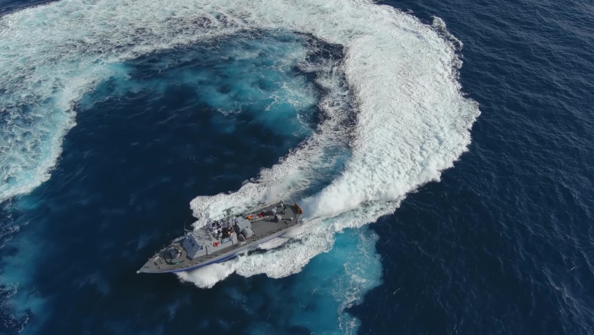 Navy ship in action sailing in Full speed, aerial view
The Idf Dabur is a class of patrol boats built in the United States for the Israeli Navy, 2022, drone view
