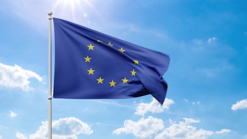 European Union Flag with golden stars flutters in the wind against a blue sunny sky Royalty-Free Stock Footage #1092325083