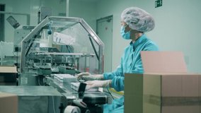 Health care, drugs production, pharmacist working, pharmaceutical manufacturing, pharmaceutical industry concept. Female medical worker doing drug packaging job - Powered by Shutterstock - Get 15% off with code: PIKWIZARD15