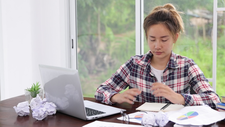 The girl is stressed because she is working too hard. Tired office workers, failure at work Royalty-Free Stock Footage #1092338537
