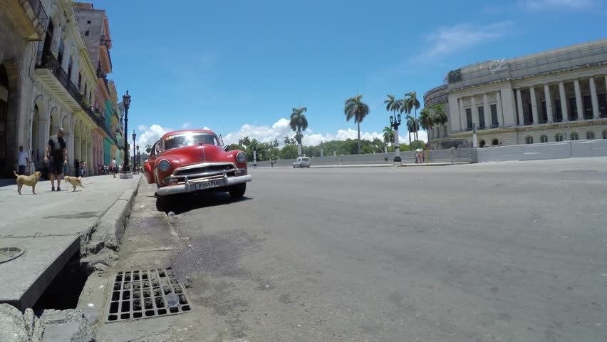 HAVANA, CUBA - CIRCA JULY, 2015: Traffic in the Havana city, old timers at the streets, buildings.