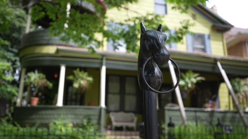 Closeup of horse hitching ring on post in front of mansions in Julia Ann Historic district downtown neighborhood in Parkersburg, WV.