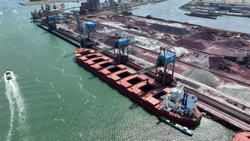 Bulk Carrier Ship Offloading Cargo By Crane for Processing