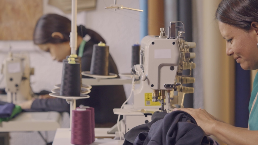 Latin women use a sewing machine in their craft workshop. Royalty-Free Stock Footage #1092375449