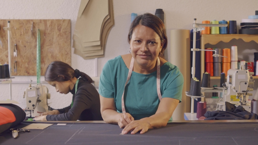 Latin women making clothes in an artisan workshop. | Shutterstock HD Video #1092375457