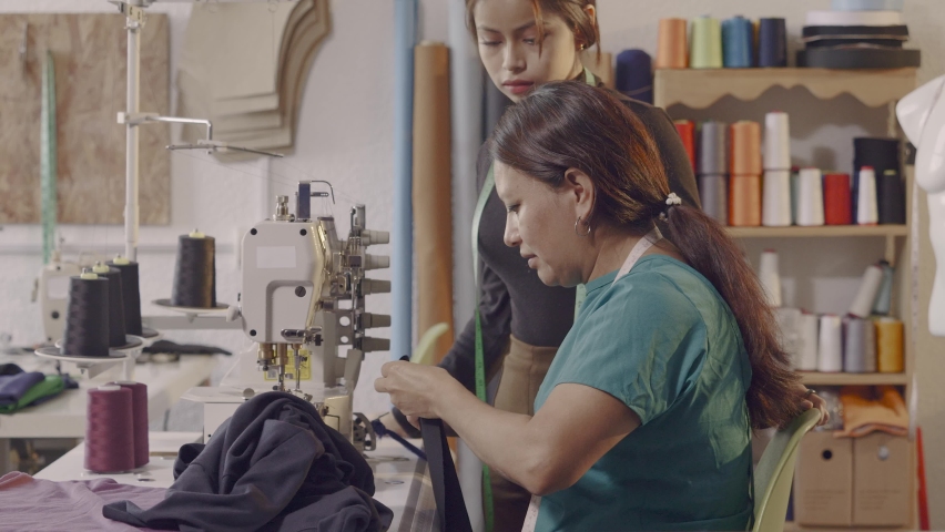 Latin women use a sewing machine in their craft workshop. Royalty-Free Stock Footage #1092375465
