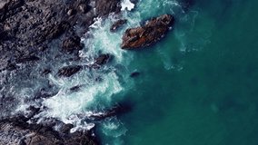 Top-down aerial view of rock beach deep blue ocean waves amazing and beautiful video Tropical Sea Andaman Sea Location Patong beach Phuket Thailand : 4K Video High quality Apple ProRes HQ