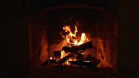 screen saver Background. Burning Fire In The Fireplace. A Looping Clip of a Fireplace with Medium Size Flames Winter and Christmas Holidays Concept