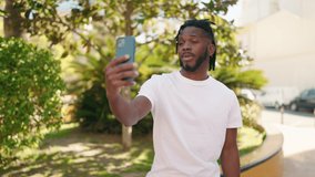 African american woman smiling confident having video call at park