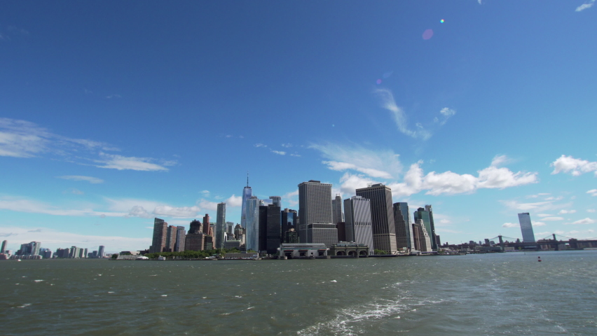 View from NYC ferry. Skyscrapers of Manhattan, the most densely populated and geographically smallest borough of NYC. It is the urban core of the New York metropolitan area. | Shutterstock HD Video #1092394667