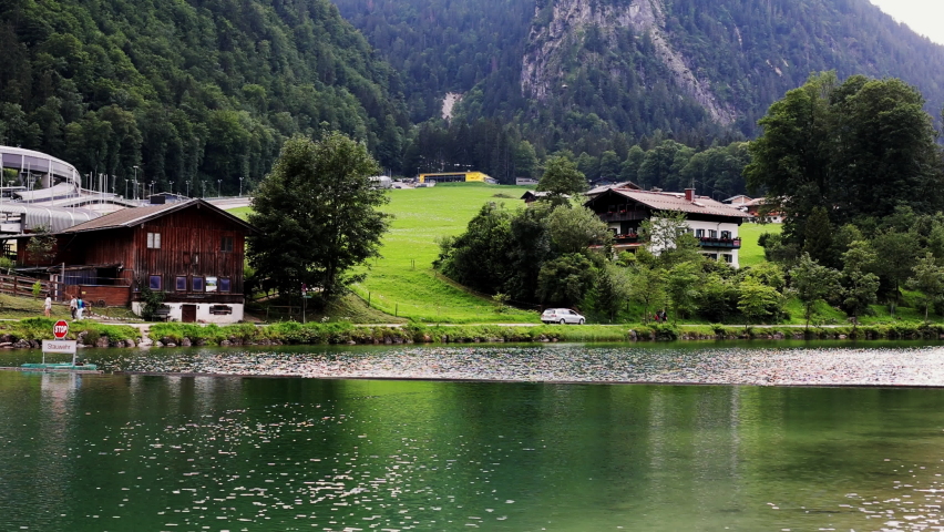 Summer rural landscape with lake and white house in Hallstatt, Upper Austria. European alps and Hallstatter lake in Salzkammergut region
