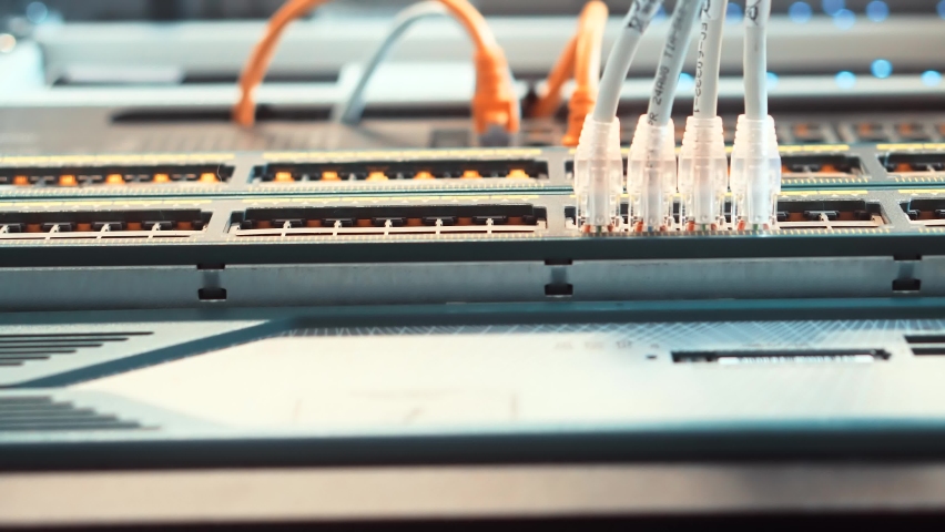 Technician Testing Network Connection. Hardware Updates On Server Room. Engineer Connect Network Cable To Switch. Data Center Network Cable Network Technology. System Administrator Configures Ethernet Royalty-Free Stock Footage #1092397513