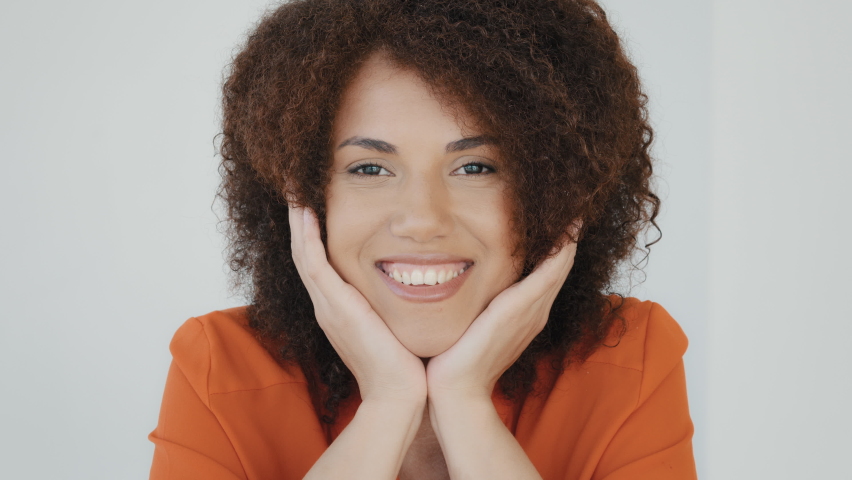Portrait close-up enthusiastic female face girl shocked lady with curly hair woman smiling looking at camera opens mouth says wow delight shock surprise win victory reaction wonder amazed expression Royalty-Free Stock Footage #1092399751