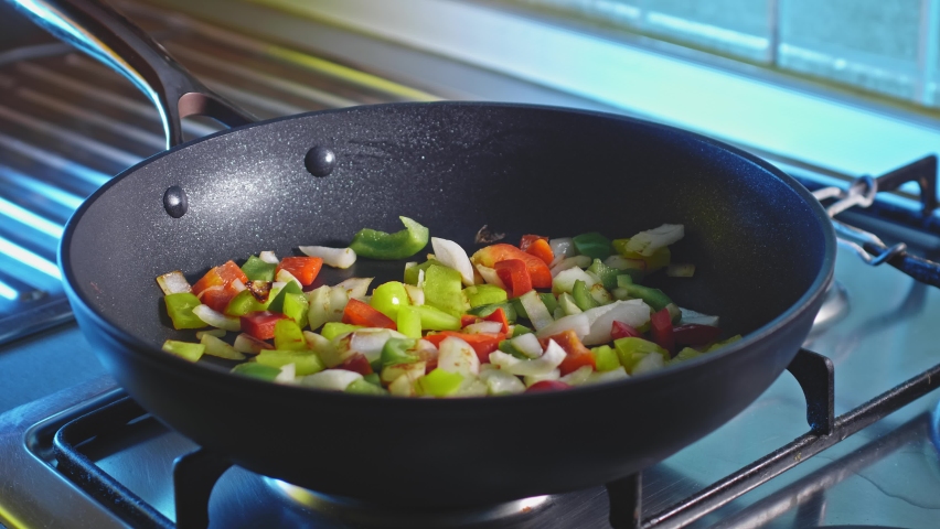 Bell Pepper And Onion Cooking In A Pan Then Add Fresh Ground Turkey Meat. Chili Con Carne Recipe. close up