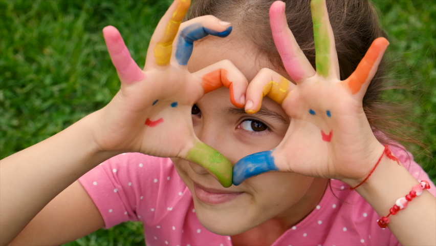 Child hands park drawing paint. Selective focus. | Shutterstock HD Video #1092403907