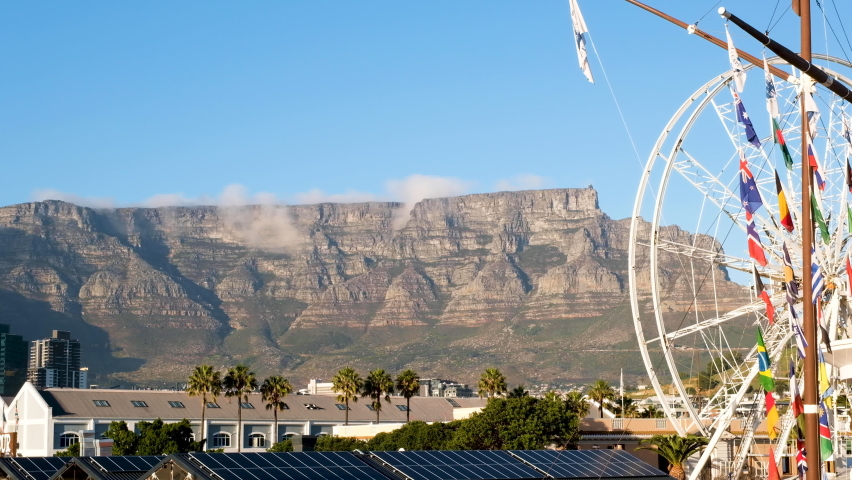 Majestic Table Mountain towering over Cape Town; view from V+A Waterfront
