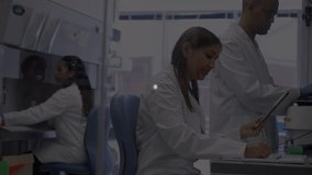 Animation of connections over diverse female and male lab workers. Science, medicine and laboratory concept digitally generated video.