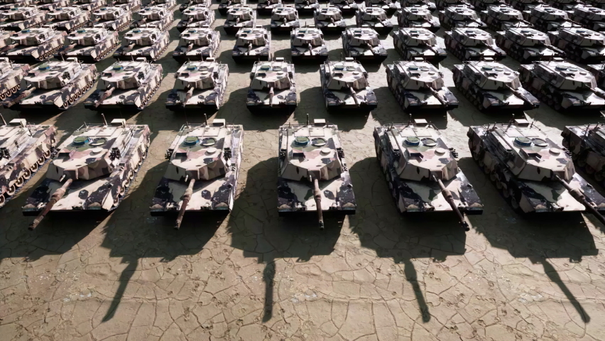 An aerial view over hundreds of military armored tanks ready to be moved to the front line of the war.