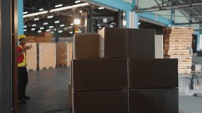 Forklift driver loading a shipping cargo container pallet with cardboard boxes in warehouse. International import and export business concept. - Powered by Shutterstock - Get 15% off with code: PIKWIZARD15