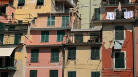 4K video with the beautiful village Riomaggiore from Cinque Terre touristic region at the seashore. Landmark of Italy.