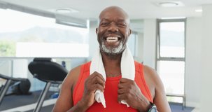 Video of thoughtful senior african american men is exercising at the gym. Retirement lifestyle, spending time alone,active leisure time.