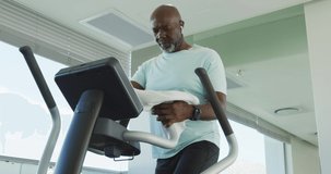 Video of senior african american men is exercising at the gym. Retirement lifestyle, active leisure time.