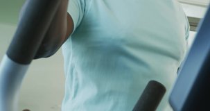 Video of thoughtful senior african american men is exercising at the gym. Retirement lifestyle, spending time alone,active leisure time.