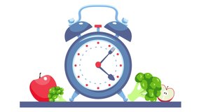 the fork and spoon move like clock hands. retro alarm clock and healthy food. healthy eating concept. Clock hands show intermittent fasting