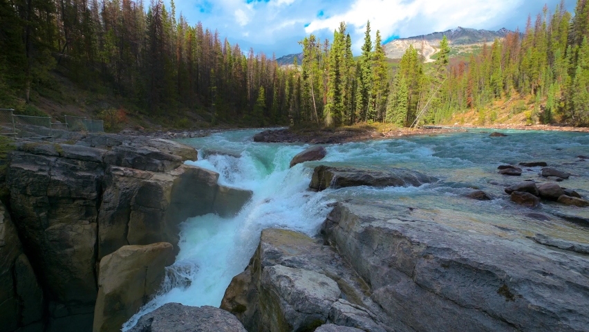 Upper Sunwapta Falls in Jasper National Park, Canada. This waterfall is located on the Sunwapta River and its water originates from the Athabasca Glacier. 4K UHD video.