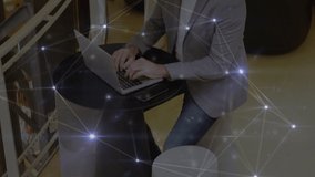 Glowing network of connections over thoughtful caucasian businessman using a laptop at office. Global networking and business technology concept - Powered by Shutterstock - Get 15% off with code: PIKWIZARD15