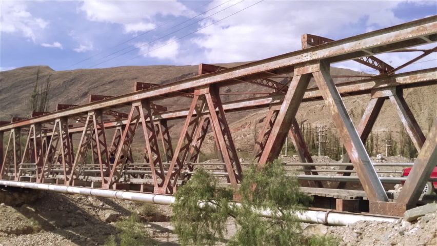 A Car Crossing An Old Bridge in Tilcara, Jujuy Province, Andes Mountains, Argentina. 