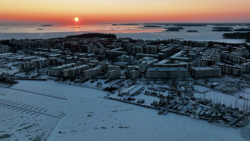 Sunset on the coast of Lauttasaari, Helsinki, during winter sunset - Aerial view