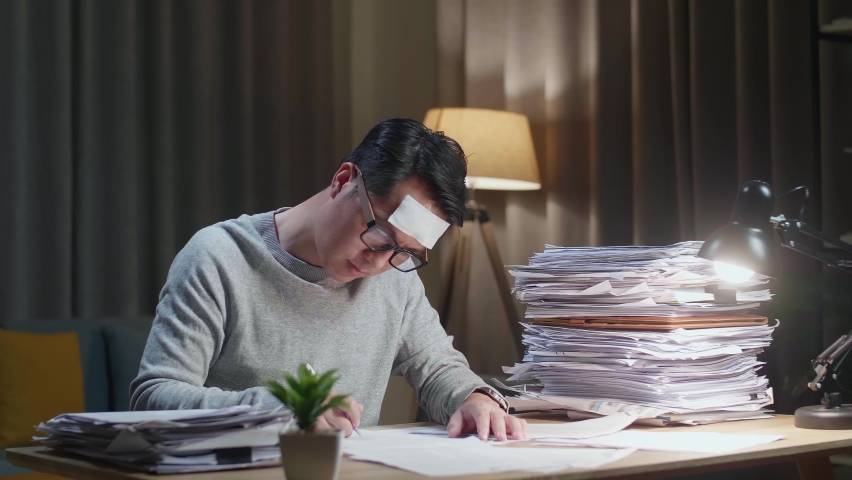 Sick Asian Man Working Hard With Documents At The Home
 | Shutterstock HD Video #1092448207