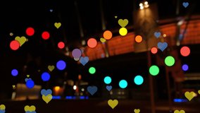 Animation of dots and hearts floating over blurred night cityscape. Music, entertainment and night city life concept digitally generated video. - Powered by Shutterstock - Get 15% off with code: PIKWIZARD15