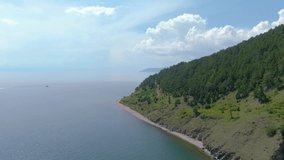  Flight over the rocky shore of lake. Wildlife. Green Forest. Drone video 4k footage. Landscape. Coastline.