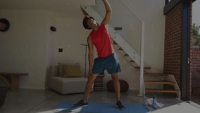 Animation of data on digital screen over african american man exercising at home. Sport, fitness, active lifestyle and technology concept digitally generated video.