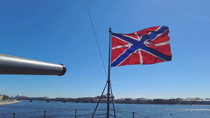 SAINT PETERSBURG, RUSSIA Close-up shot of a flag on the cruiser Aurora on a sunny summer day. Famous cruiser museum on the Neva river