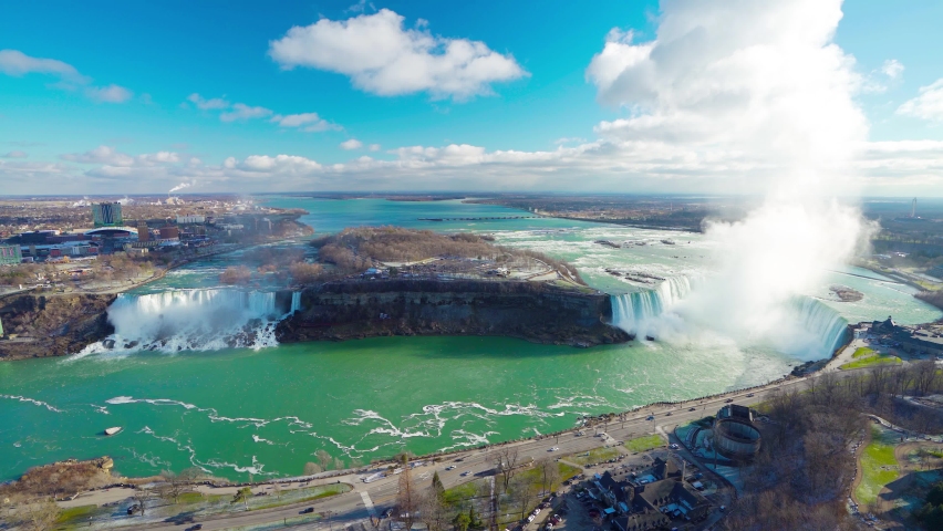 Overlooking the Niagara Falls ( American Falls and Horseshoe Falls ) in a sunny day.