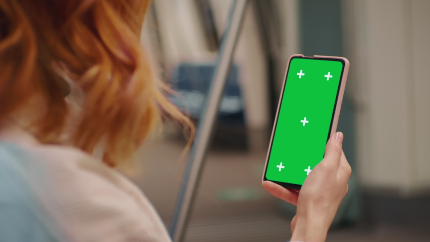 Woman hands on green screen phone watching news on a train. Technology in the underground. Ignorance in public places. Copyspace phone. Green Screen Mock Up Display. | Shutterstock HD Video #1092476969