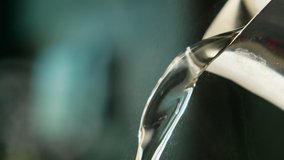 Slow motion hot water pouring from a teapot. Hot water is pouring from the kettle. 4K - Powered by Shutterstock - Get 15% off with code: PIKWIZARD15