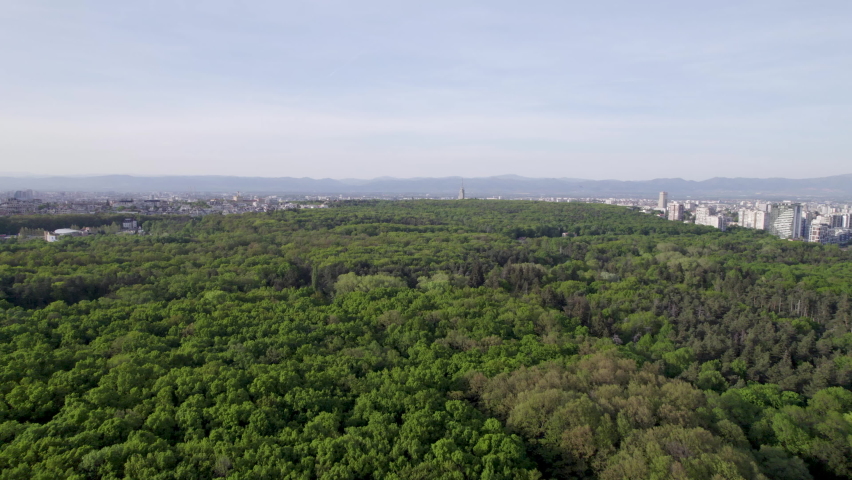 Aerial view of Hunting park and Sofia city in Bulgaria. Top view of green trees in city park