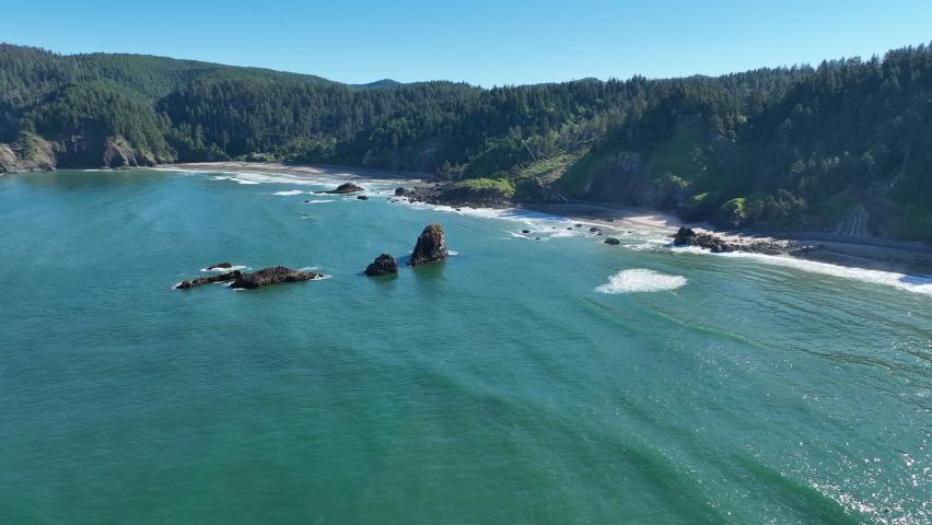 Basalt sea stacks lie just off the Northern Oregon shoreline, not far west of Portland. This part of the Pacific Northwest is full of scenic forests and impressive coastlines.