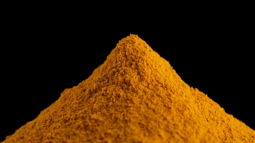 Spice turmeric powder. Sprinkle turmeric powder, close up. 4K UHD footage Royalty-Free Stock Footage #1092504111